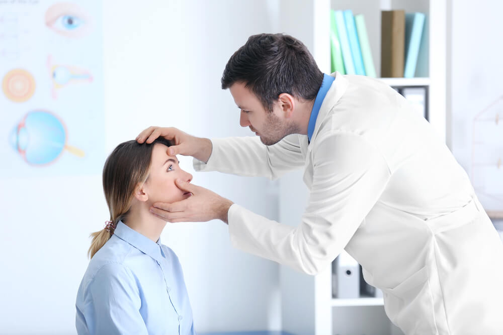 Doctor giving an eye exam